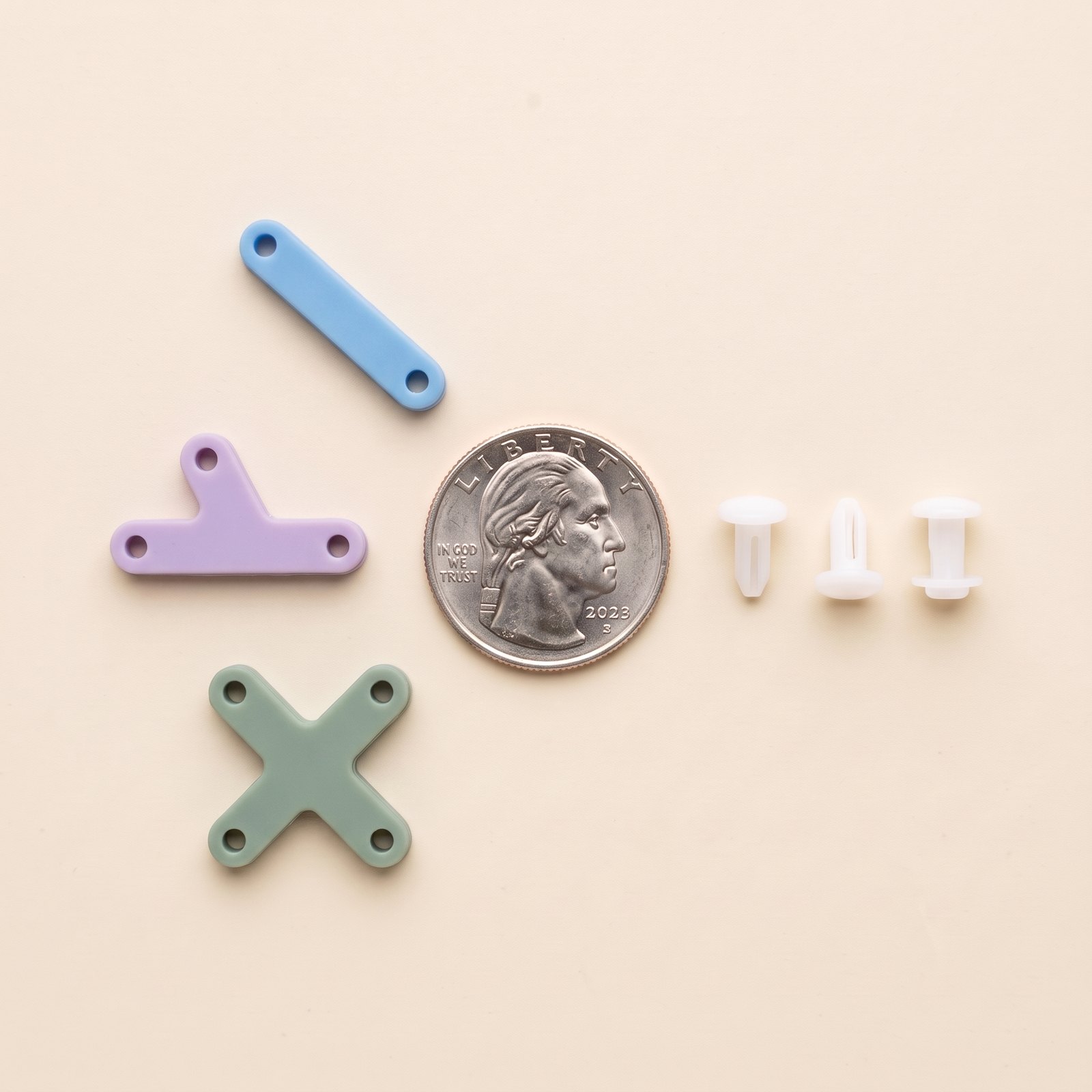 Bar in blue, Y in lavender, X in sage, with three holders and a quarter